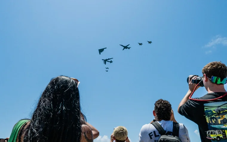 People watching planes fly overhead People watching planes fly overhead