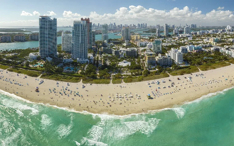 Aerial view of South Beach with the Downtown Miami skyline in the background Aerial view of South Beach with the Downtown Miami skyline in the background
