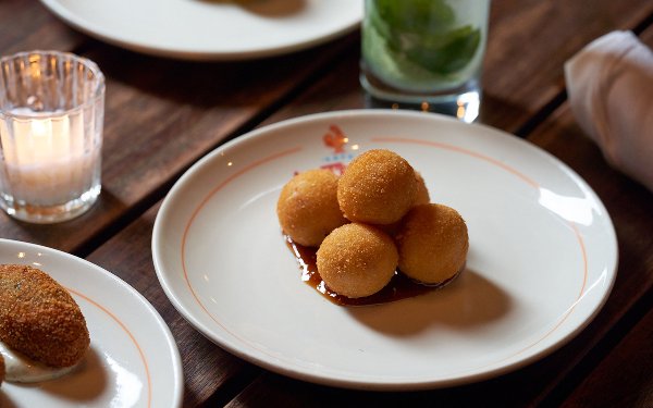 Jamon serrano croqueta, a fried Spanish ham croquette.