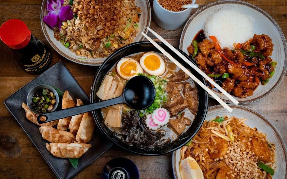 Table spread of a variety of dishes at 107 Taste