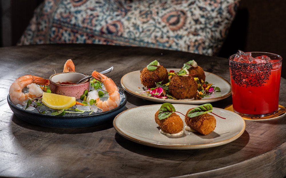 Glass of wine served dishes at Vinya Table
