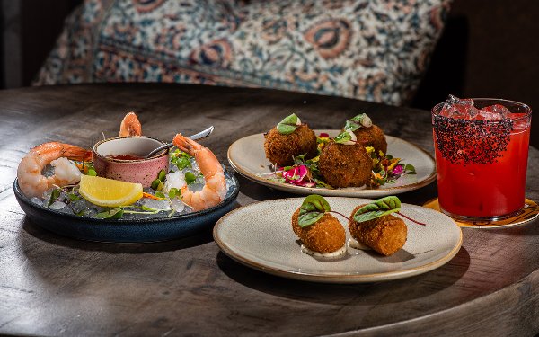Glass of wine served dishes at Vinya Table