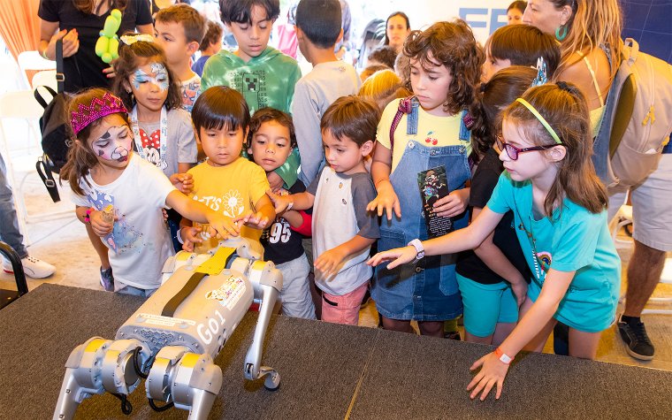 Kids petting robotdog at Children's Alley Kids petting robotdog at Children's Alley
