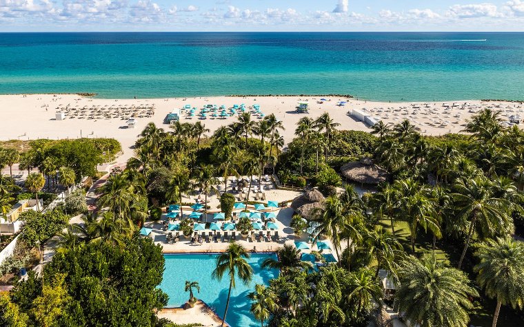 Aerial view of the beach and pool area at The Palms Hotel & Spa Aerial view of the beach and pool area at The Palms Hotel & Spa