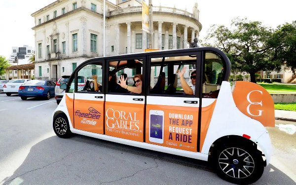 People riding Freebee transportation in Coral Gables