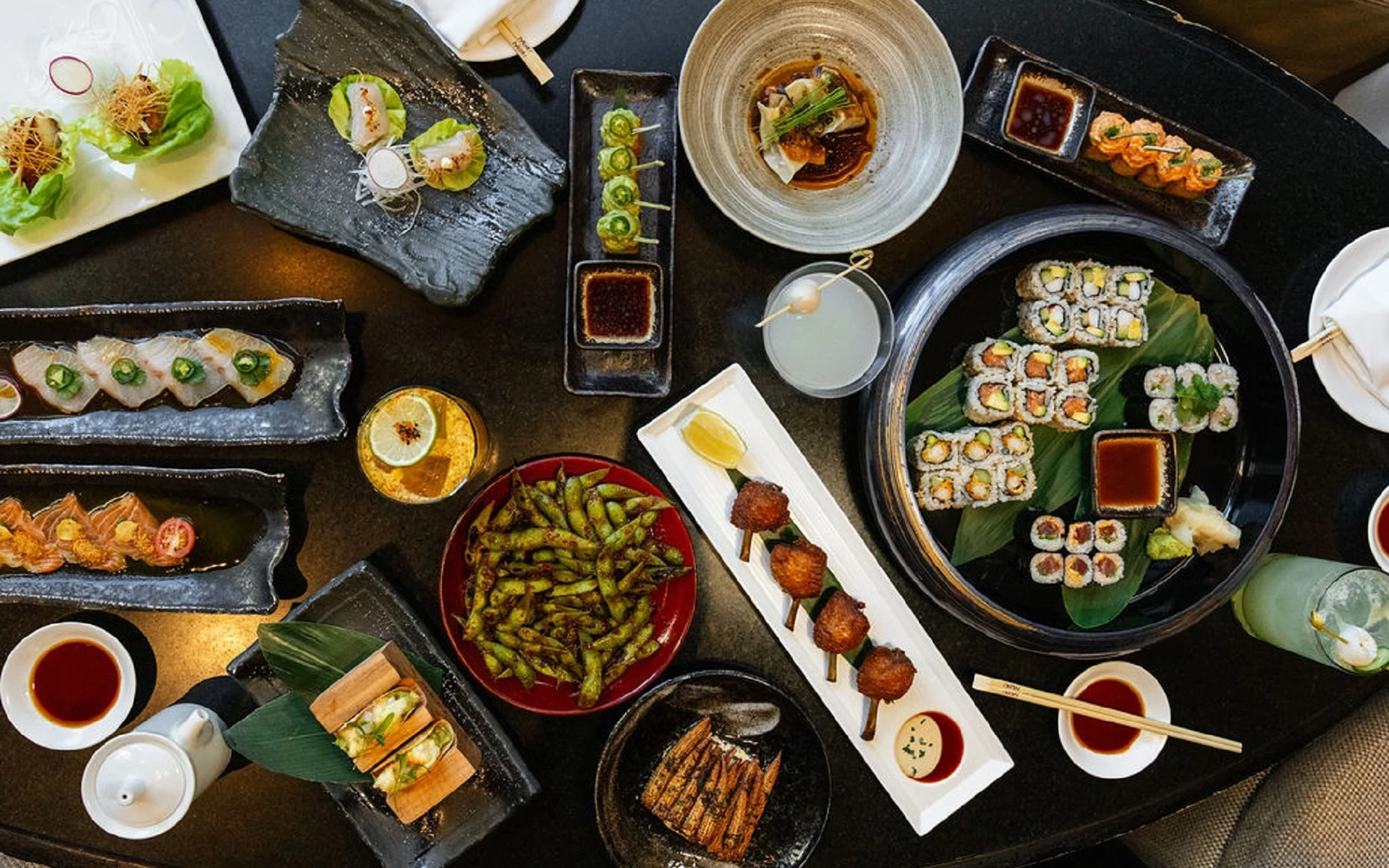 Nobu restaurant spread featuring assorted sushi and Japanese dishes Nobu restaurant spread featuring assorted sushi and Japanese dishes