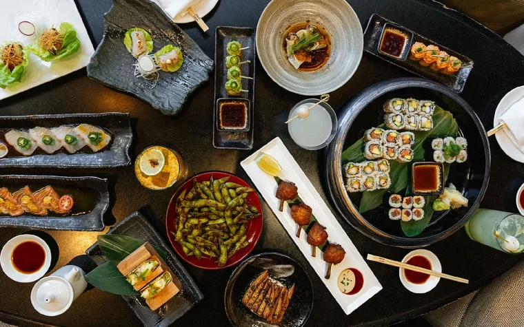 Nobu restaurant spread with assorted sushi and Japanese dishes Nobu restaurant spread with assorted sushi and Japanese dishes