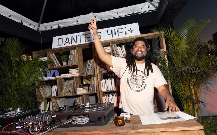 DJ at Dante's Hifi making peace sign DJ at Dante's Hifi making peace sign
