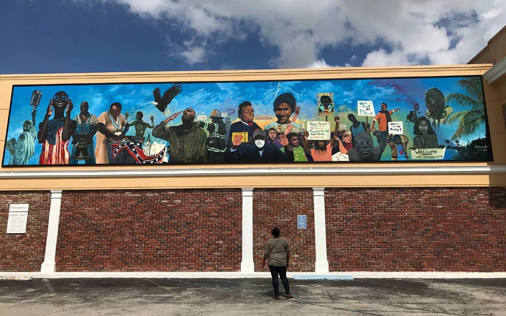 Mural on the side of One United Bank building by Addonis Parker