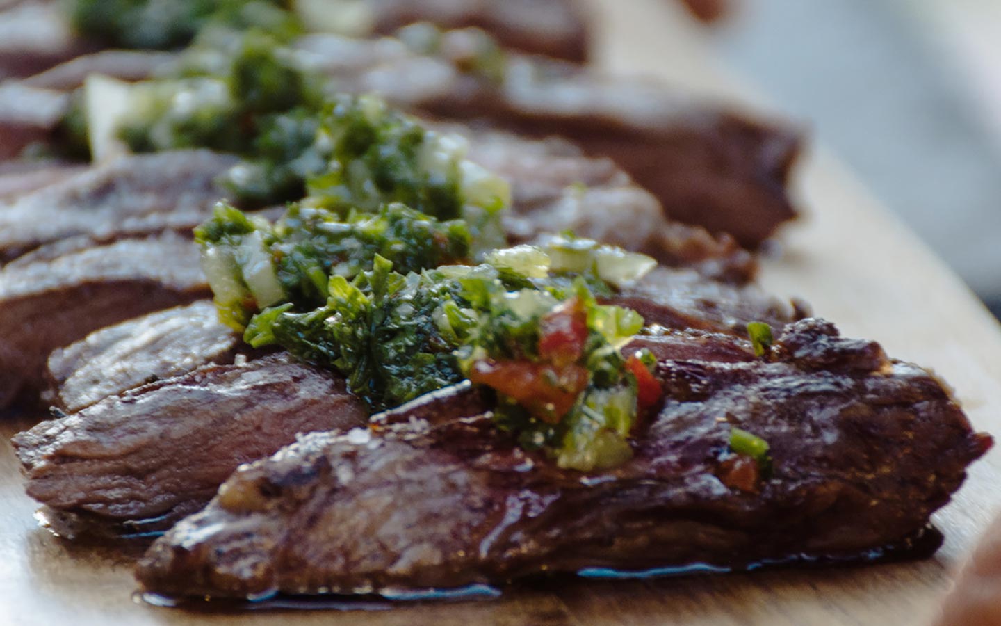 Steak served with chimichurri at Novecento
