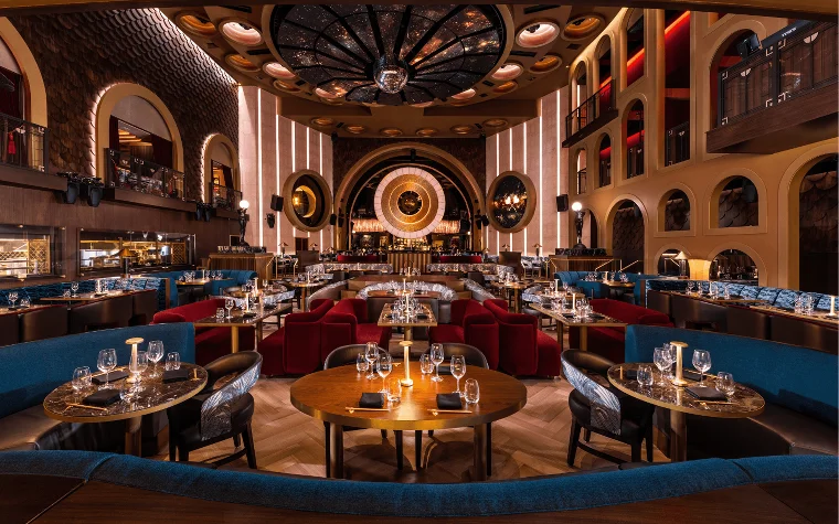 Queen Miami Beach main dining room with elegant tables Queen Miami Beach main dining room with elegant tables