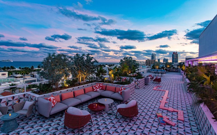 Rooftop deck at Moxy hotel showcasing a large-scale outdoor dominoes game Rooftop deck at Moxy hotel showcasing a large-scale outdoor dominoes game