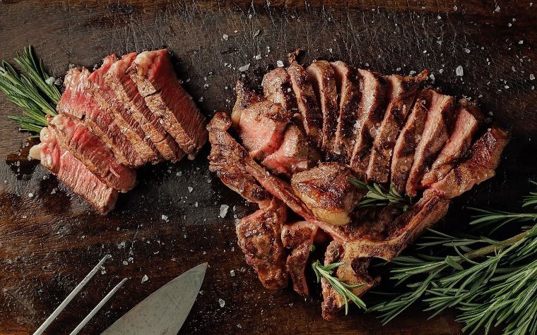 Steak garnished with rosemary at Platea Miami Steak garnished with rosemary at Platea Miami