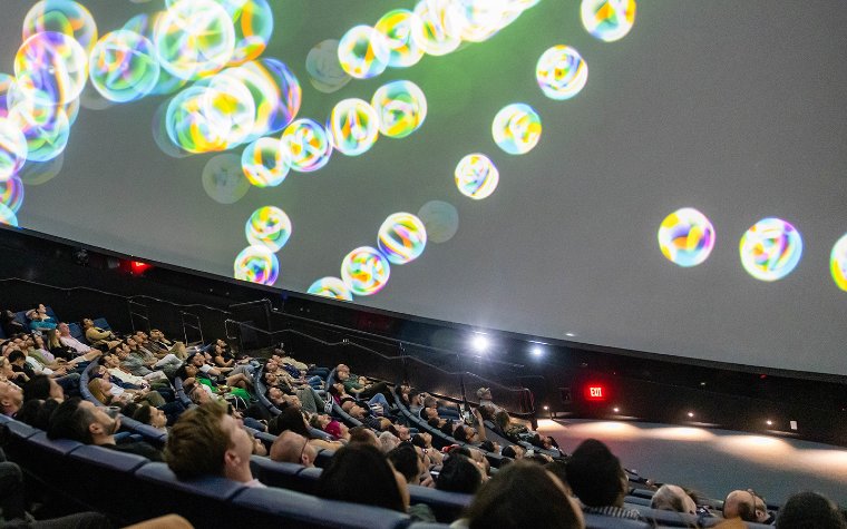 Visitors watching a planetarium show at Frost Science Museum