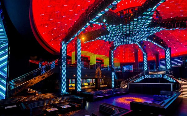LIV's interior glows under red and blue neon lights