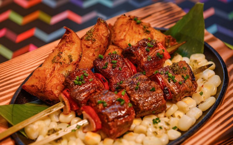 Grilled beef skewers with Peruvian corn at Jarana