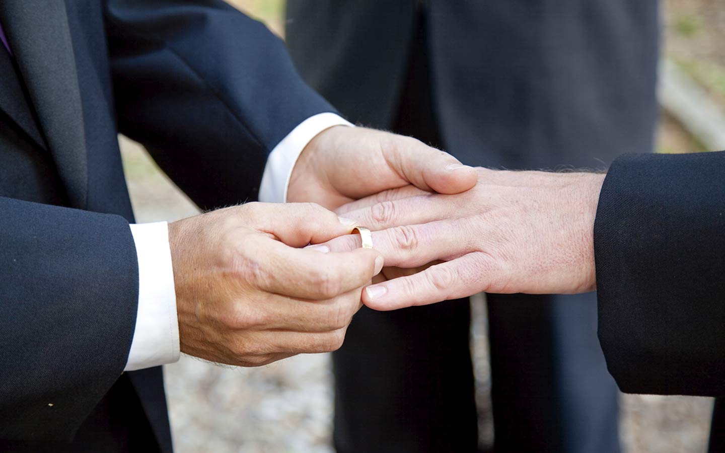 Couple exchanging wedding rings Couple exchanging wedding rings