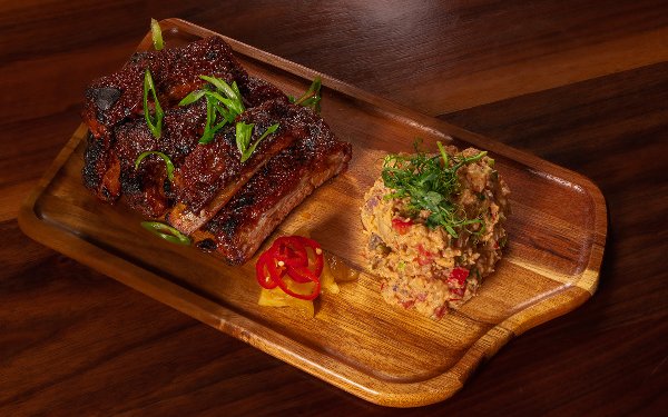 BBQ pulled pork piled high next to glazed rib sat Red Rooster Overtown