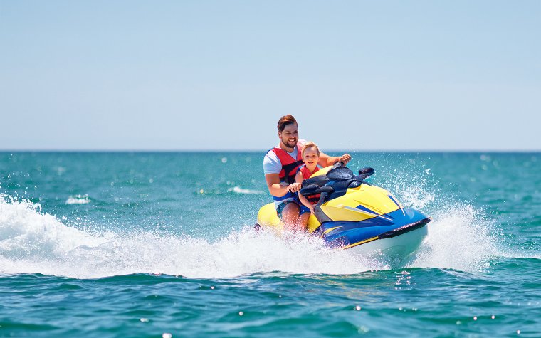 Father and son on a jet ski