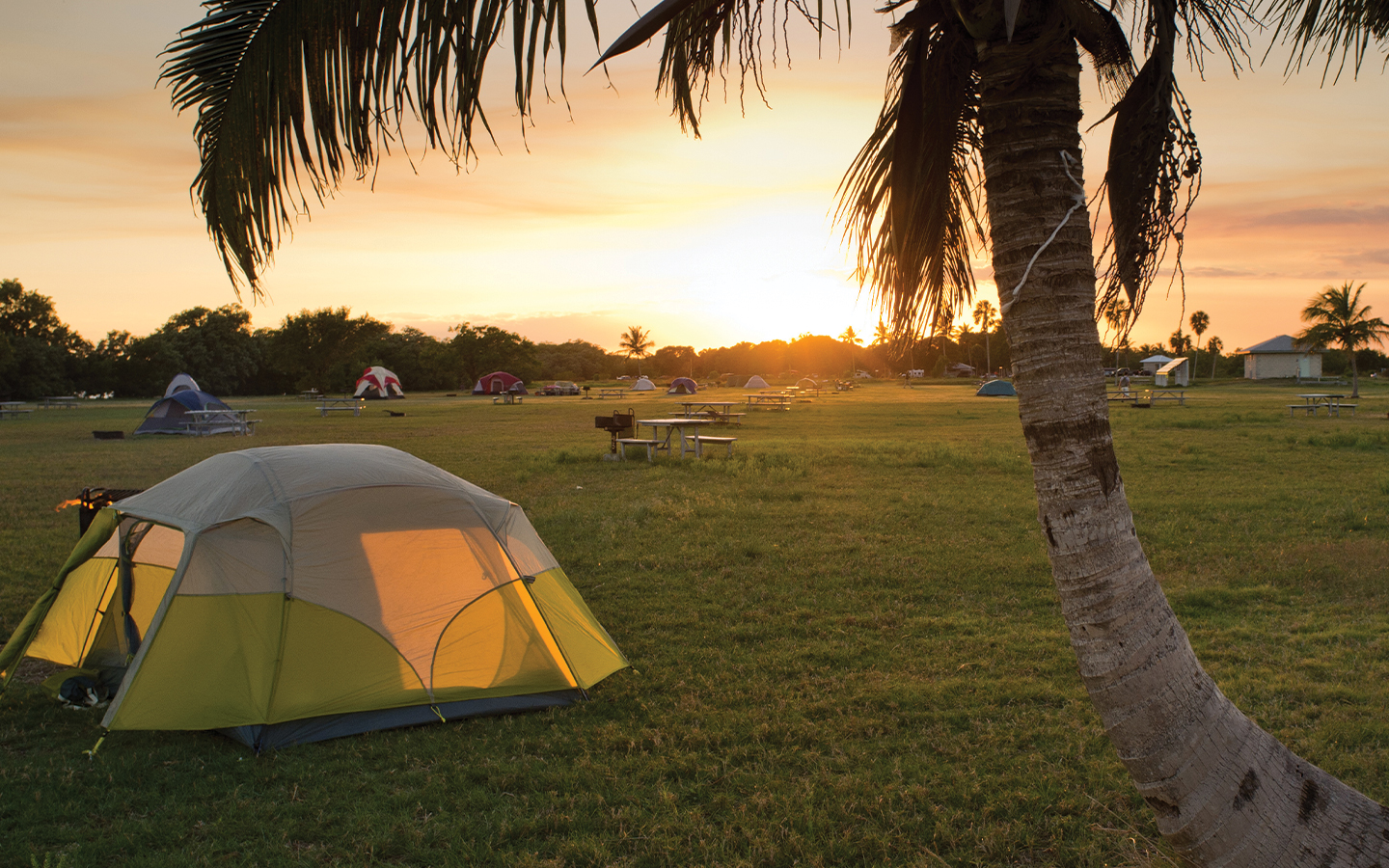 Sun rising over tents