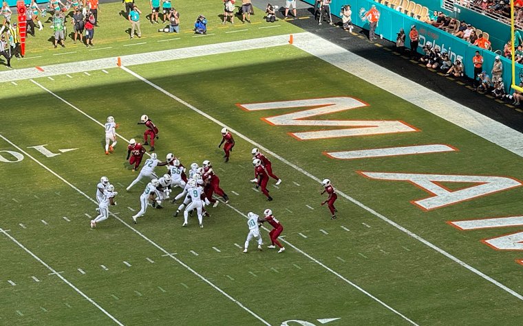 Miami Dolphins in action on the football field Miami Dolphins in action on the football field