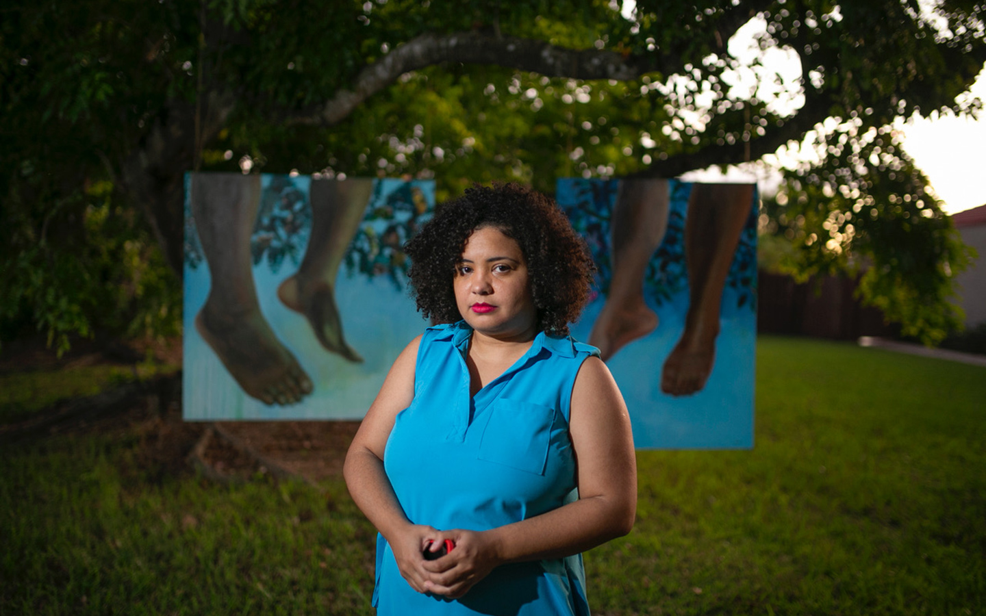 Strange Fruit Ripe' by Annick Duvivier showing paintings of feet in the green trees