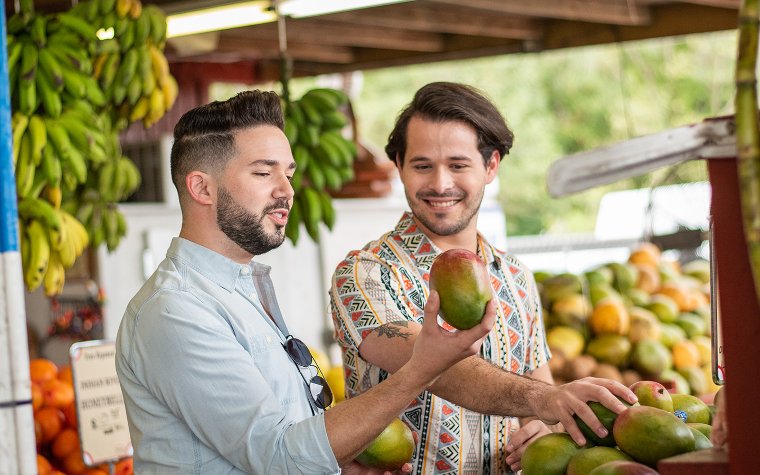 Men enjoying mango picking at Robert Is Here