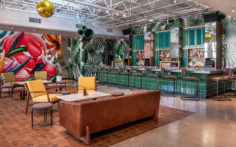 Freehold's tropical interior with flamingo mural Freehold's tropical interior with flamingo mural