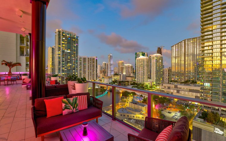 Romantic balcony seating at Rosa Sky with city views Romantic balcony seating at Rosa Sky with city views