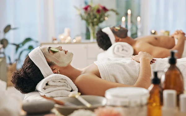 Couple receiving a relaxing massage treatment side by side