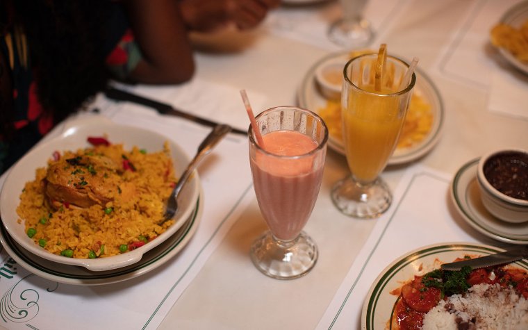 Yellow rice and chicken and black beans, plantain chips and shakes Yellow rice and chicken and black beans, plantain chips and shakes
