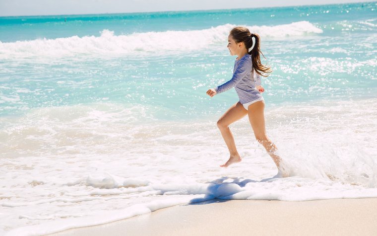 Girl playing on Surfside Beach