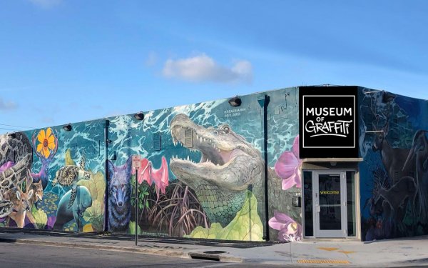 Colorful murals on Museum of Graffiti's exterior west wall
