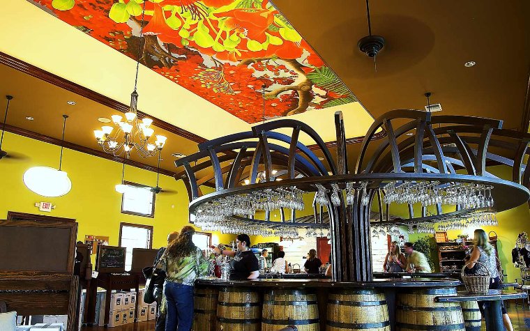 View of the tasting bar at Schnebly Winery, showcasing wine glasses and bottles