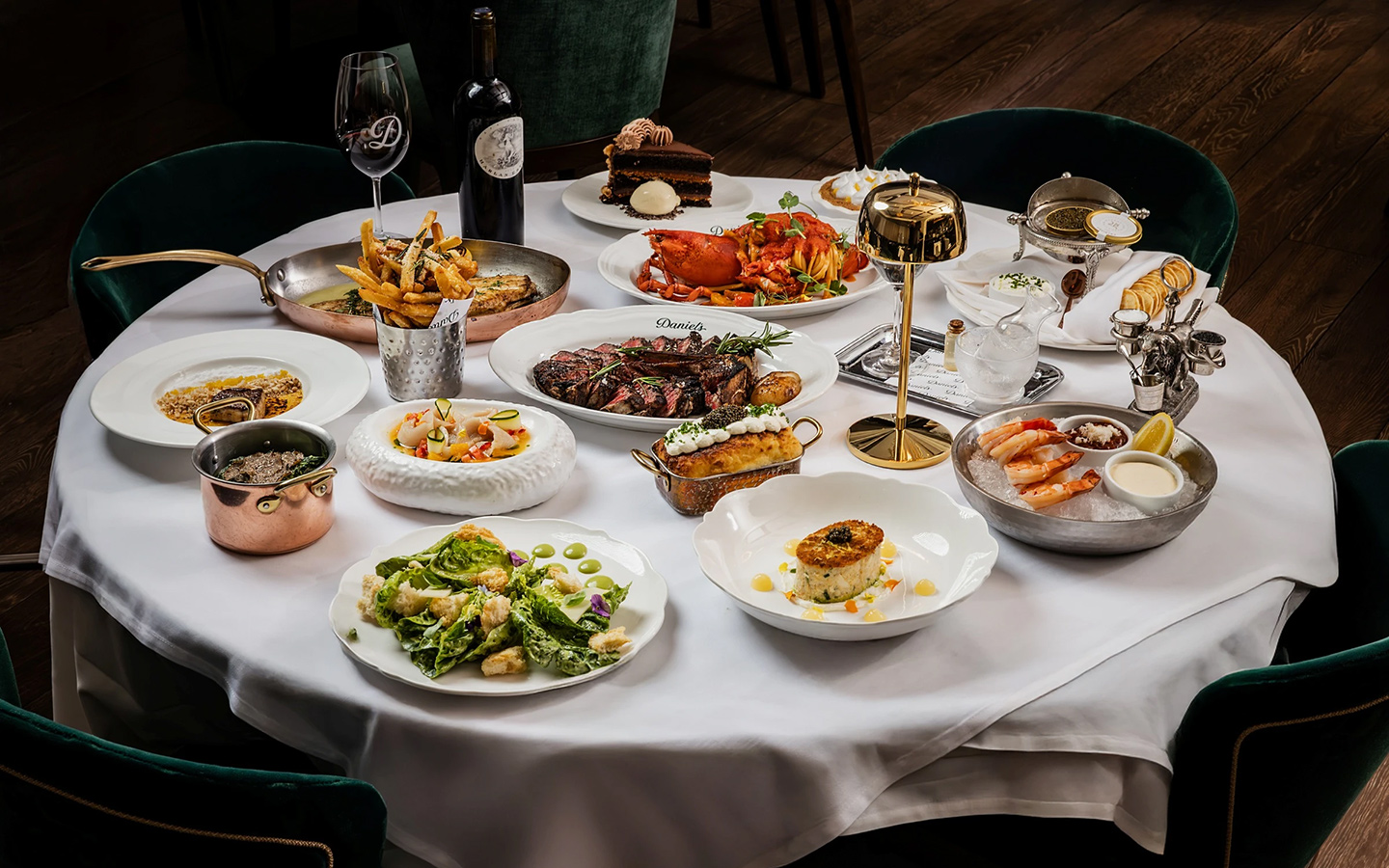 A table spread at Daniel’s Miami displaying a variety of dishes, photo by The Louis Collection A table spread at Daniel’s Miami displaying a variety of dishes, photo by The Louis Collection