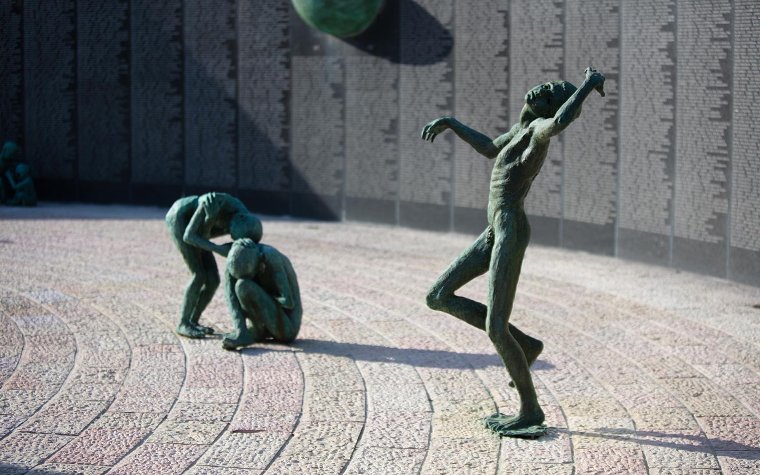 Statues of the Holocaust and memorial plaque listing names