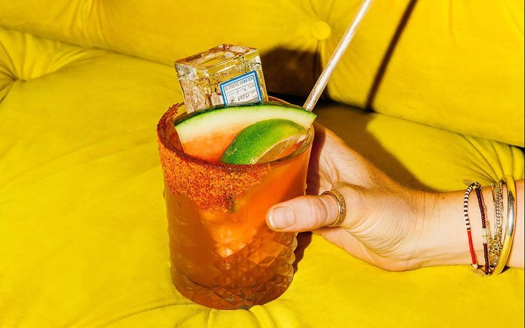 Cocktail with a watermelon garnish at Minibar