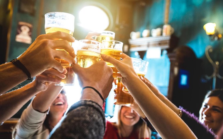 Friends raising beer glasses Friends raising beer glasses