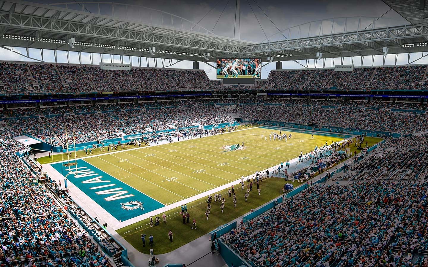 The Miami Dolphins playing in a packed stadium
