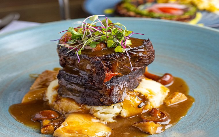Plated filet mignon served at Blue Matisse