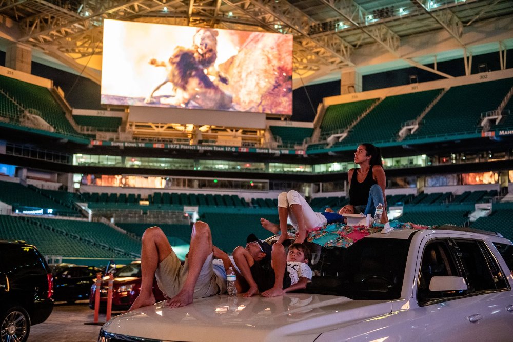 Family watching a movie on their car at the Hard Rock Stadium