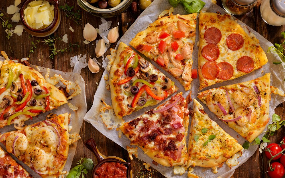 Variety of pizzas with different toppings