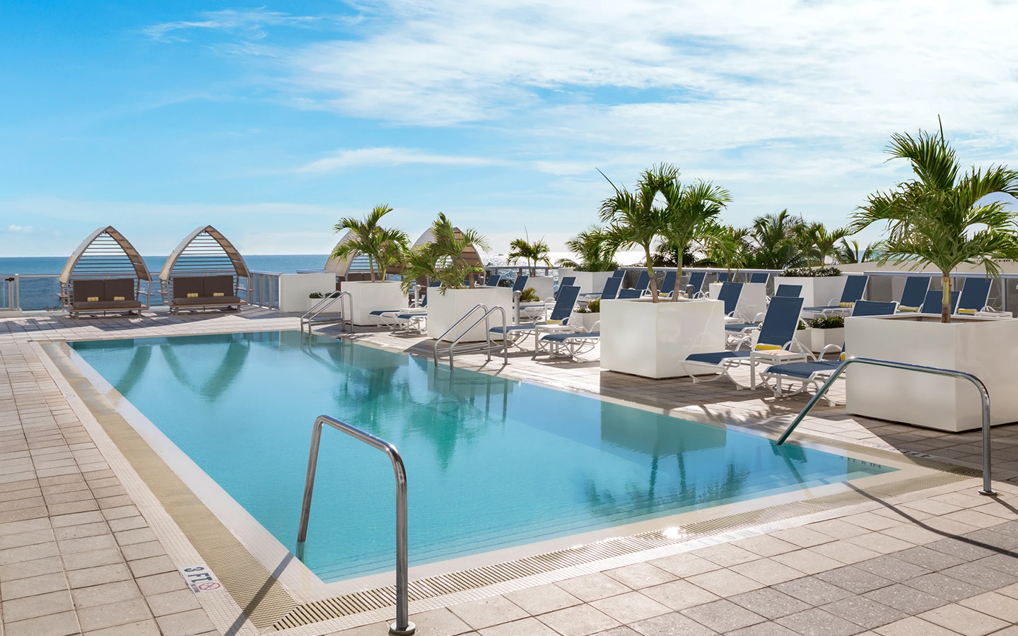 Cabanas and loungers at Hilton Cabana upper pool area
