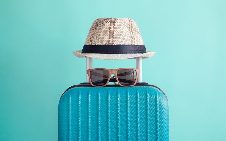 Luggage bag with hat and sunglasses Luggage bag with hat and sunglasses