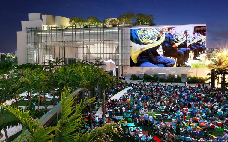 People watching the New World Symphony Wallcast under the stars