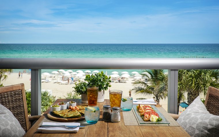 Oceanfront seating at BALEENkitchen with tables overlooking the water Oceanfront seating at BALEENkitchen with tables overlooking the water
