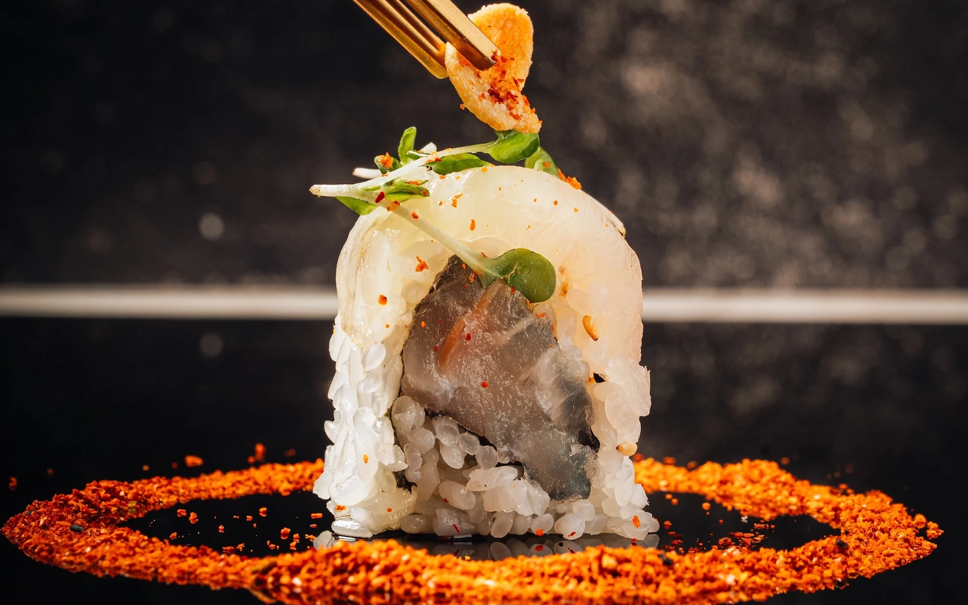 A piece of sushi displayed at Sora by Hotel Collection