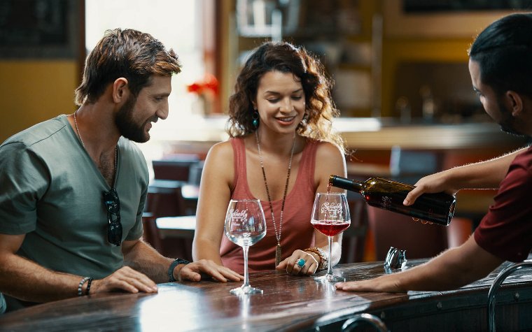 Couple tasting tropical fruit wine Couple tasting tropical fruit wine