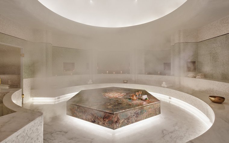 Tierra Santa Healing House's steamy room with pink & green marble hammam