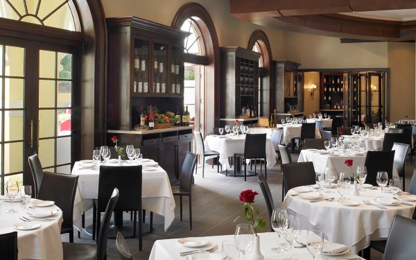 Indoor dining area at Il Mulino with elegant table settings